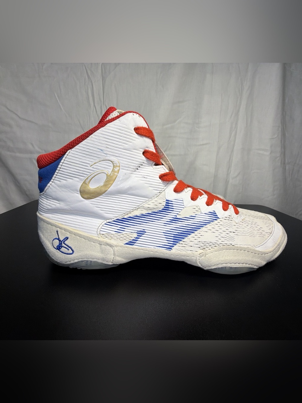 ASICS White Athletic High-Top Sneakers with Orange Laces and Blue Tongue